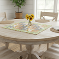 Sunflower pinwheel quilted piece styled as a table topper on a round dining table in a farmhouse setting