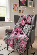 Pink black and white rag quilt draped over a chair in a cozy teen bedroom