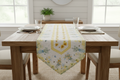 Mason jar bouquet quilted table runner displayed on a wooden dining room table in a bright summer farmhouse setting
